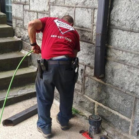 A Montco-Rooter Plumber providing plumbing service at a home in Lansdale