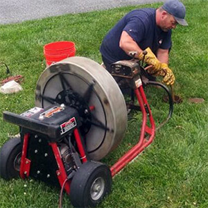 Plumber performing sewer line repair service at a Pennsylvania home